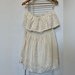 Angie sleeveless blouse size M. Embroidered cream color with ruffles.